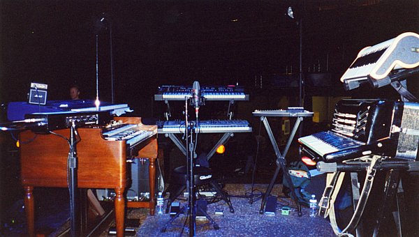 Rob's S&G rig: From Left: Moog Theremin Etherwave, Kurzweil 2600 atop Hammond B3, Prophet VS atop Alesis Andromeda, Electric autoharp, Hohner Claviola atop Accordian"